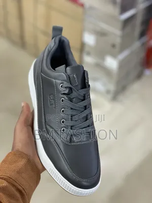 Caterpillar Men's Casual Low-Top: Dark Leather Flat Shoes