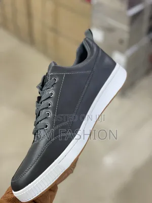 Caterpillar Men's Casual Low-Top: Dark Leather Flat Shoes