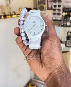 Analog Quartz Watch With a Beaded Bracelet Accessory.