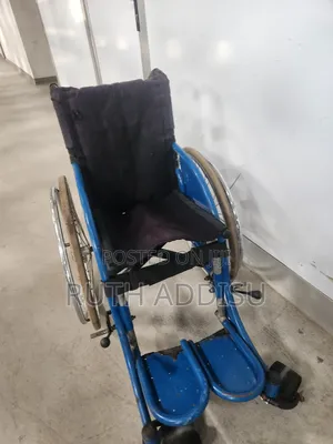 Blue Manual Wheelchair, Designed for Either Children Durable Frame