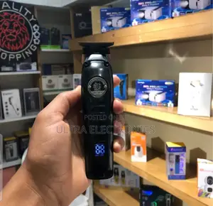Kemei Km-1827 Professional Cordless Hair Clipper and Trimmer. It