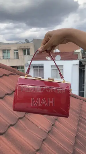 Glossy Patent Leather Top Handle Box Clutch Bag.