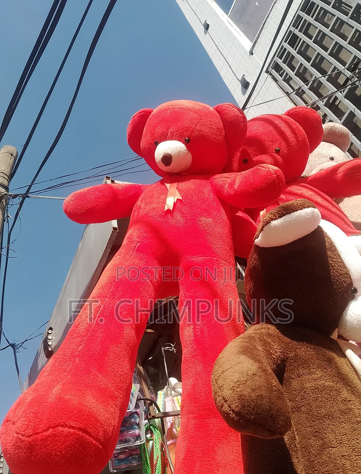 Red Long-Legged Oversized Stuffed Animal With Gold Ribbon