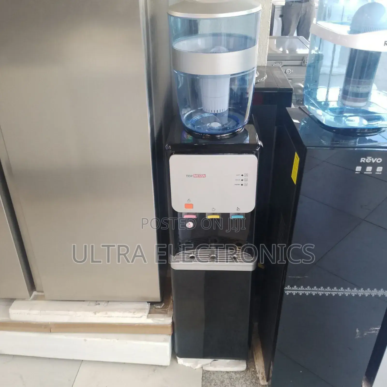 Top Media Top-Loading Water Dispenser Available in Black.