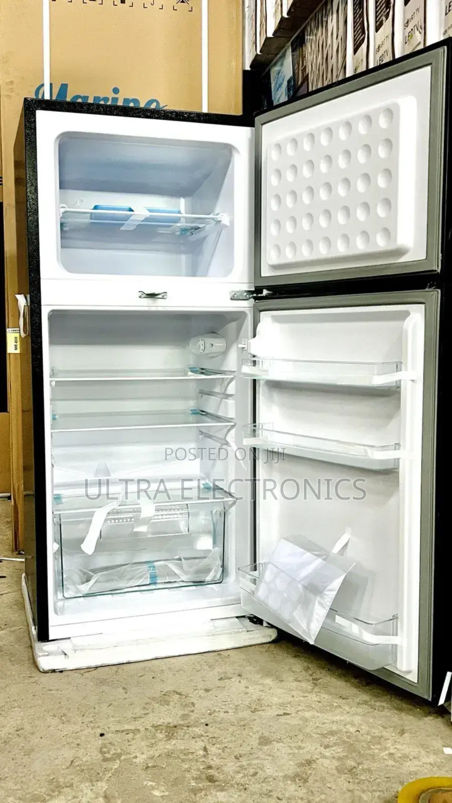 Iceland Brand Top-Freezer Refrigerator, Likely Model 210 or a Similar