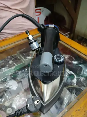 Silver Star Es-300 Gravity Feed Steam Iron. It Operates at 220 Volts
