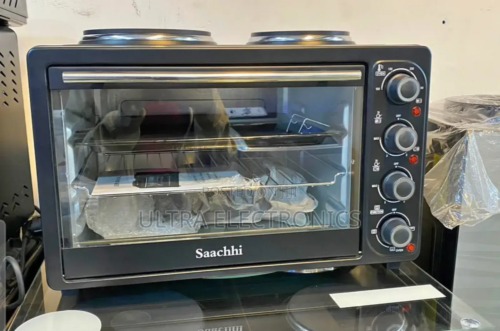 Saachi 30-Liter Electric Oven With Two Hot Plates on Top.