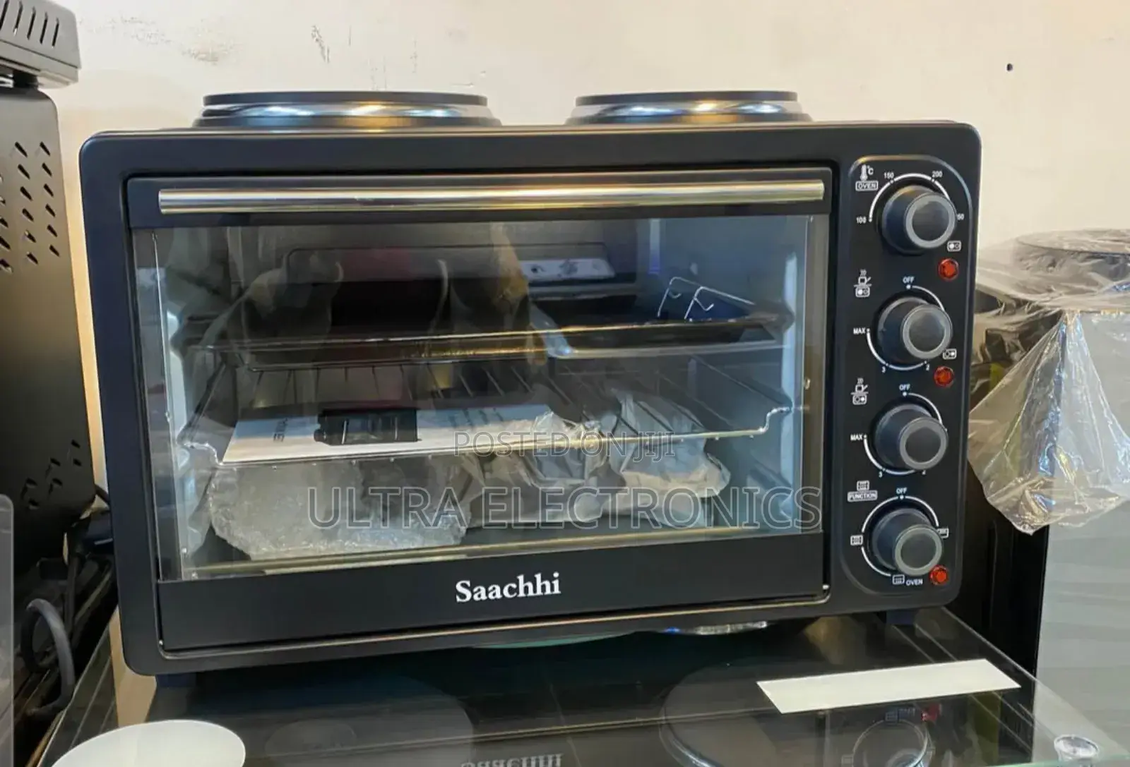 Saachi 30-Liter Electric Oven With Two Hot Plates on Top.