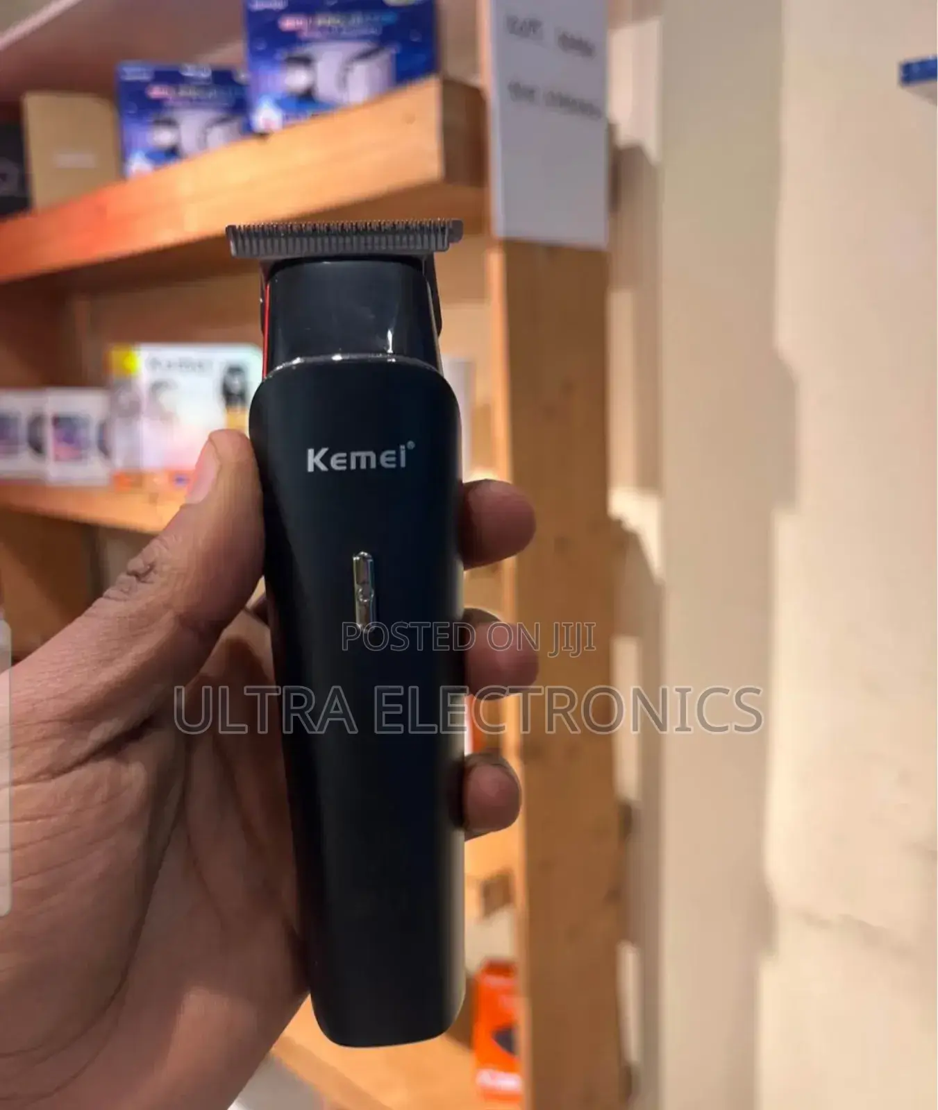 A Kemei Km-1113 Professional Hair Clipper and Beard Trimmer.