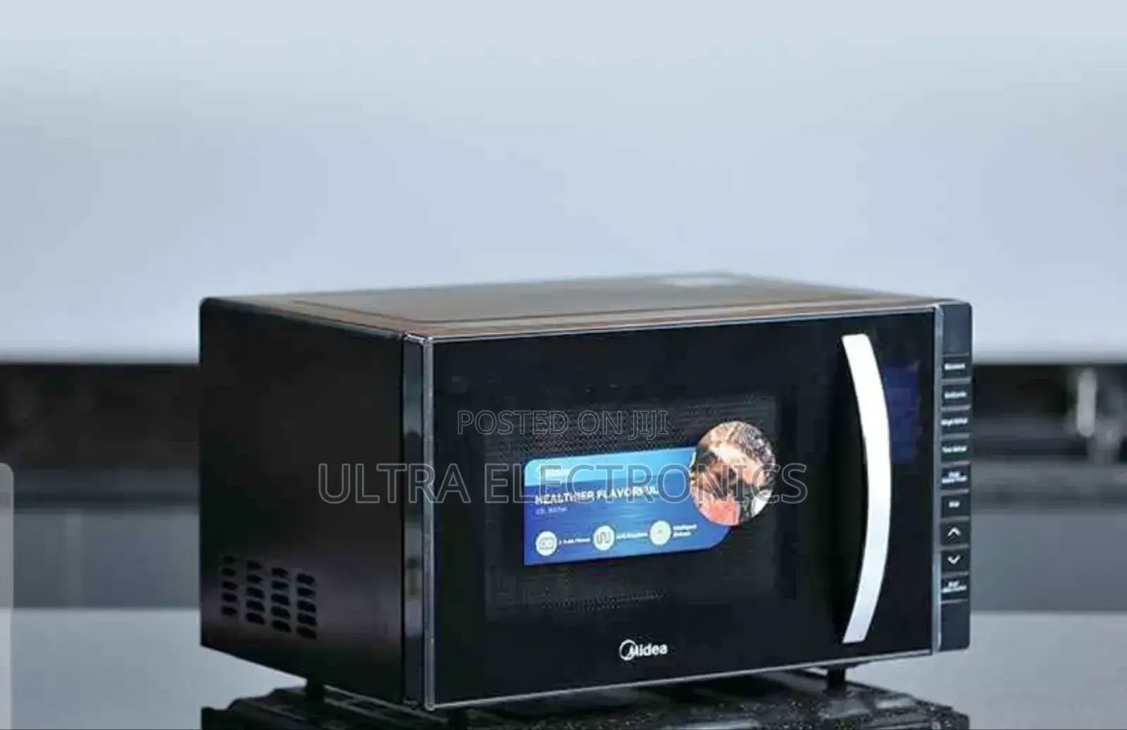 Midea Microwave Oven, Likely a 23l Model Featuring a Grill Function,