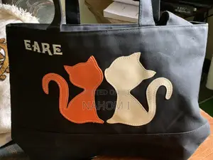 Black Canvas Tote Bag Features Decorative Cat-Shaped Appliques