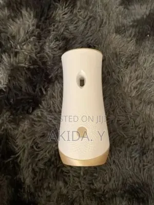 Automatic Air-freshener Sprayer Device With Spray Cans.