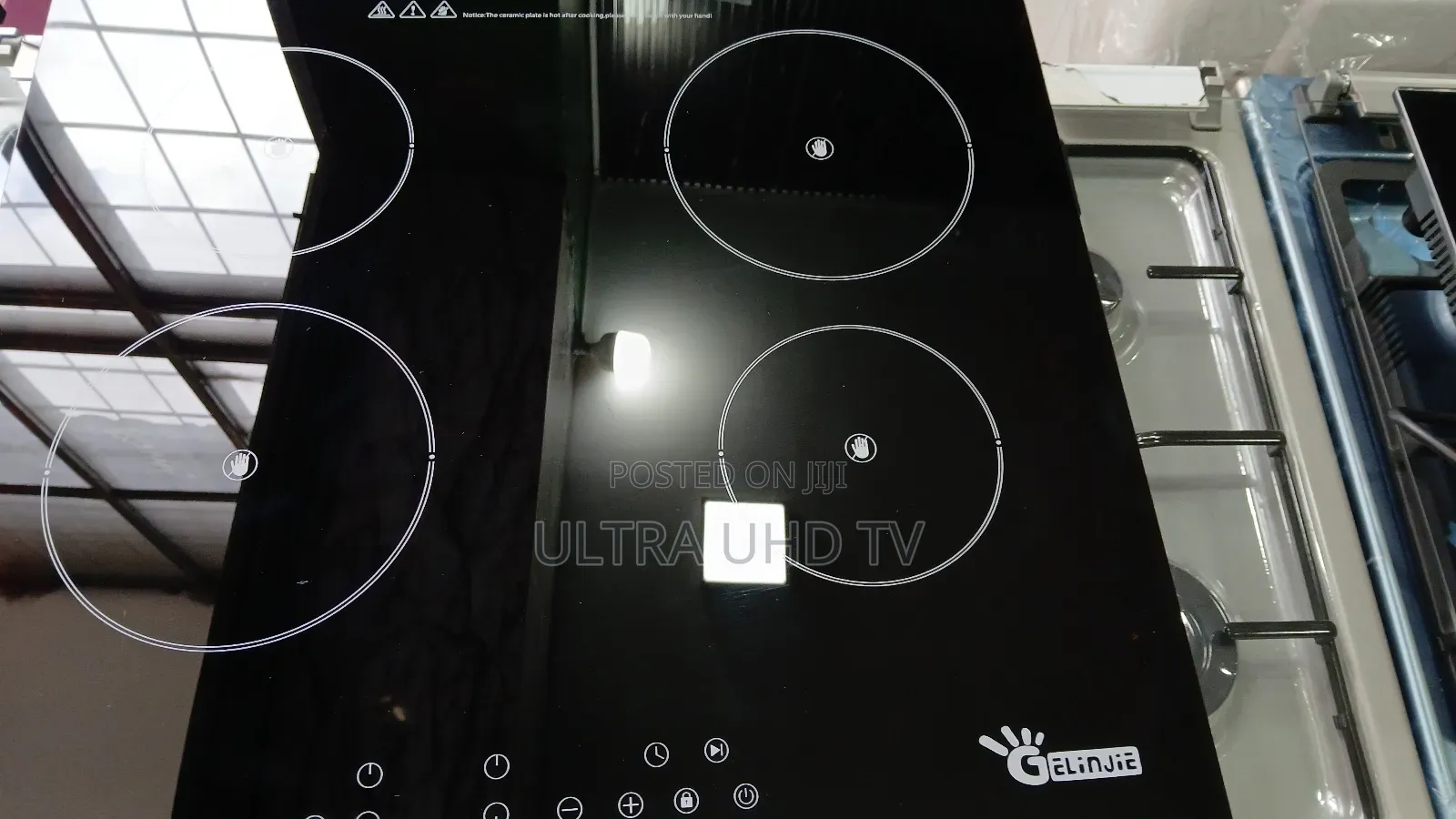 Stove Gelinjie Brand Induction Cooktop, Featuring a Sleek Black Glass