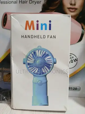 Mini Handheld Fan Packaged in Its Product Box. T