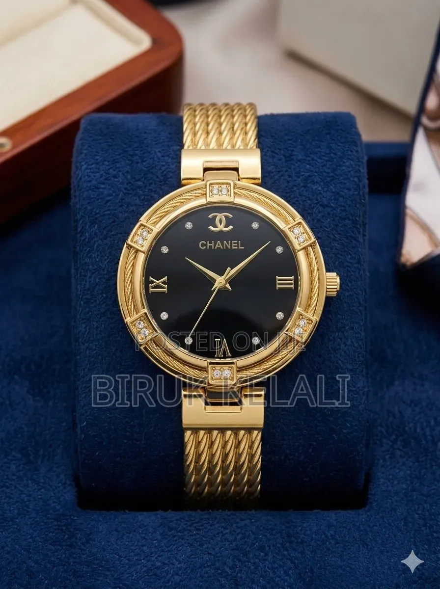 Chanel Women's Watch With a Gold-Toned Case and a Black Dial.