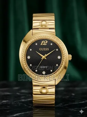 Guess Ladies' Gold-Tone Watch Features a Circular Champagne Dial