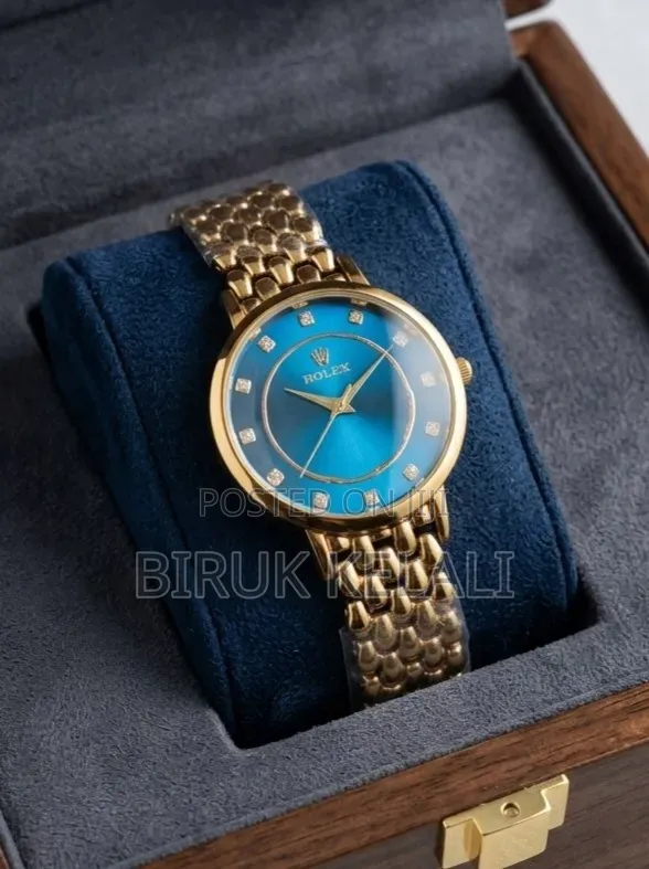 Gold-Toned Ladies' Watch Featuring a Blue Dial, Diamond Hour Markers