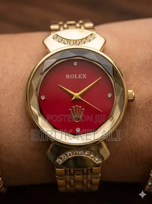 Gold-Toned Women's Watch Features a Black Dial, a Faceted Bezel