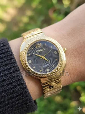 Guess Ladies' Analog Watch in Gold Tone, Featuring a Black Dial