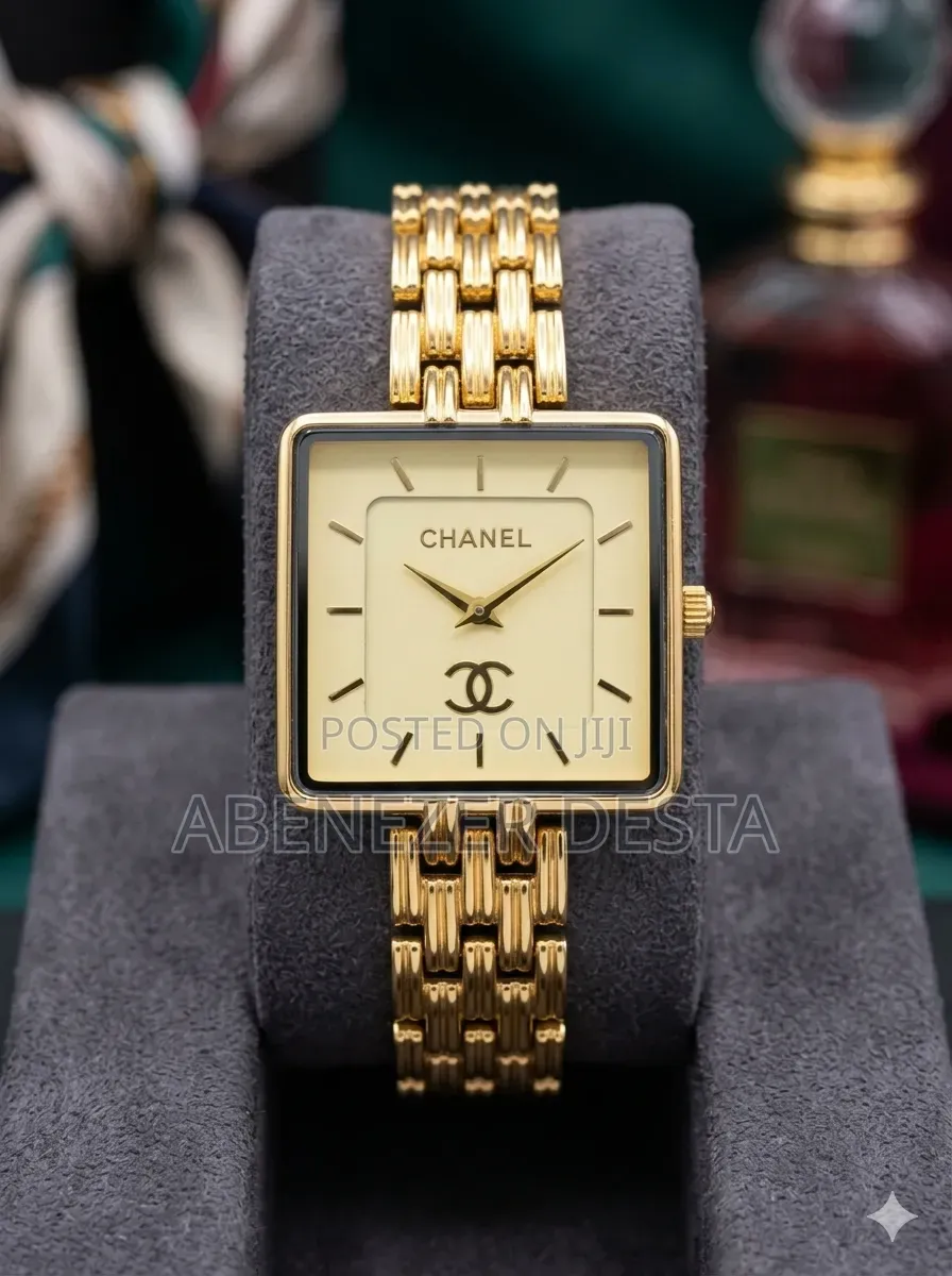 Chanel-Style Watch With a Gold-Tone Square Face and a Link Bracelet.