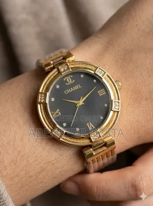 Chanel Watch With a Gold-Toned Case and a Black Dial