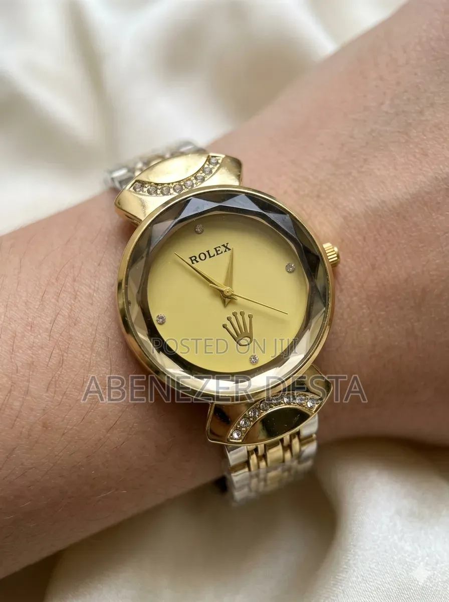 Gold-Toned Rolex Women's Luxury Watch With a Faceted Bezel.
