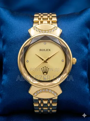 Gold-Toned Rolex Women's Luxury Watch With a Faceted Bezel.