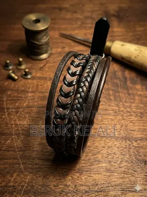 Layered Black Leather Bracelet Featuring a Stainless Steel Heartbeat