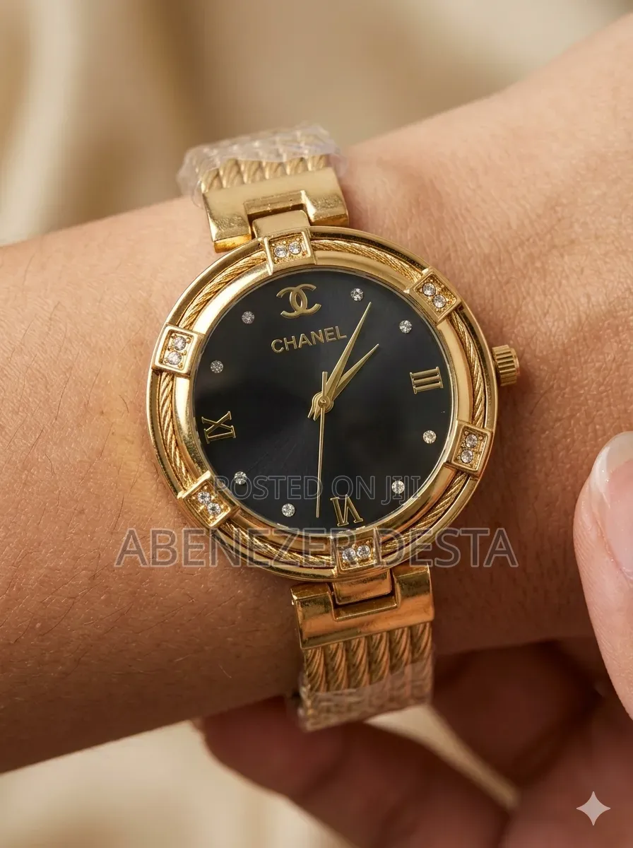 Gold-Toned Chanel Luxury Watch With a Black Dial and Diamond-Accented
