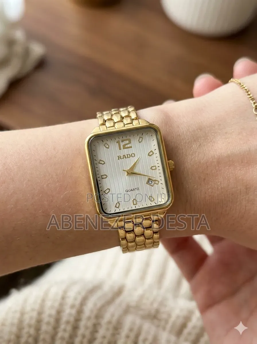 Gold-Tone Rado Quartz Watch Featuring a Rectangular Face