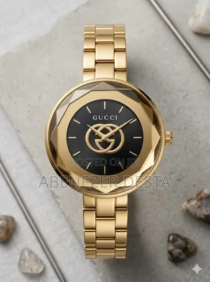 Gold-Tone Gucci Ladies' Watch With a Distinctive Bezel and Black Dial