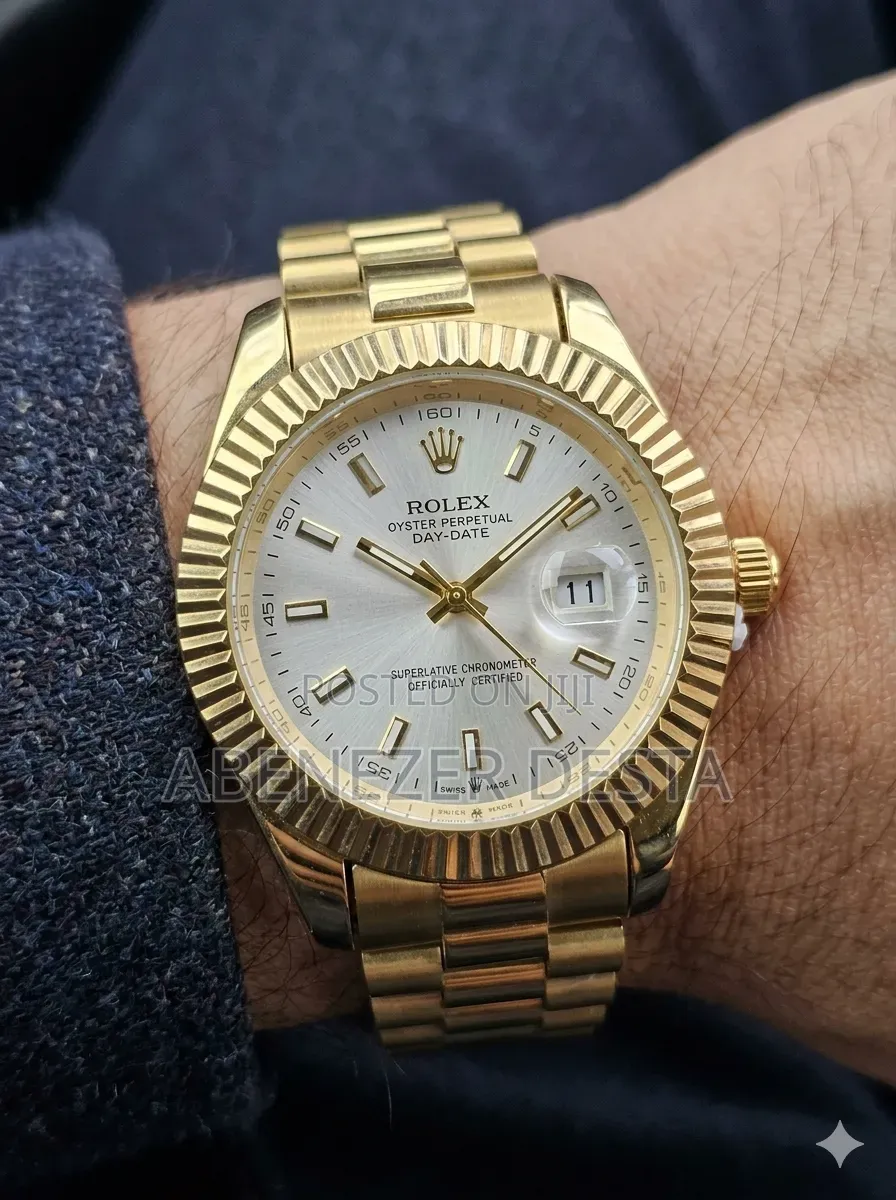 Day-Date Style Watch, Specifically a Stainless Steel Model With a Gold