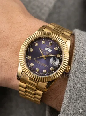 Day-Date Style Watch, Specifically a Stainless Steel Model With a Gold