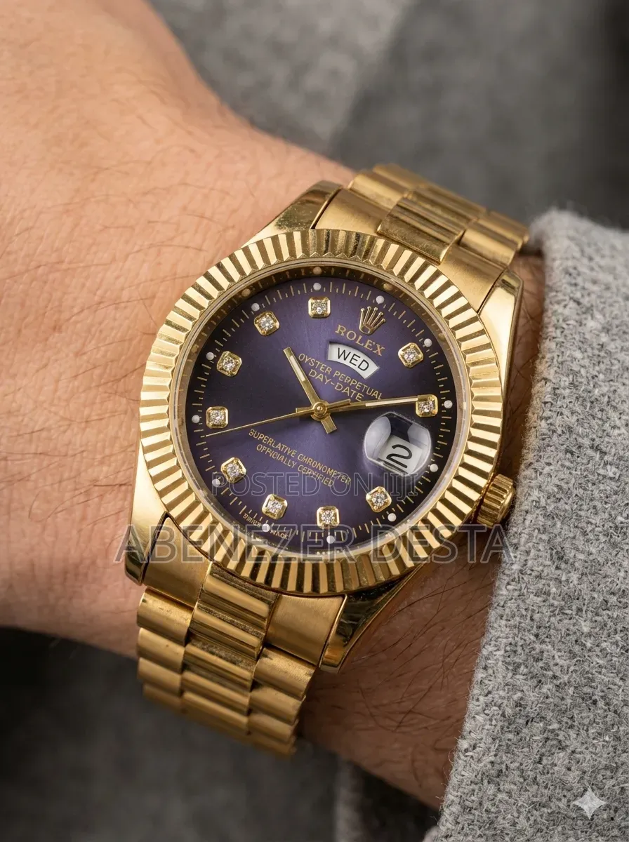 Day-Date Style Watch, Specifically a Stainless Steel Model With a Gold