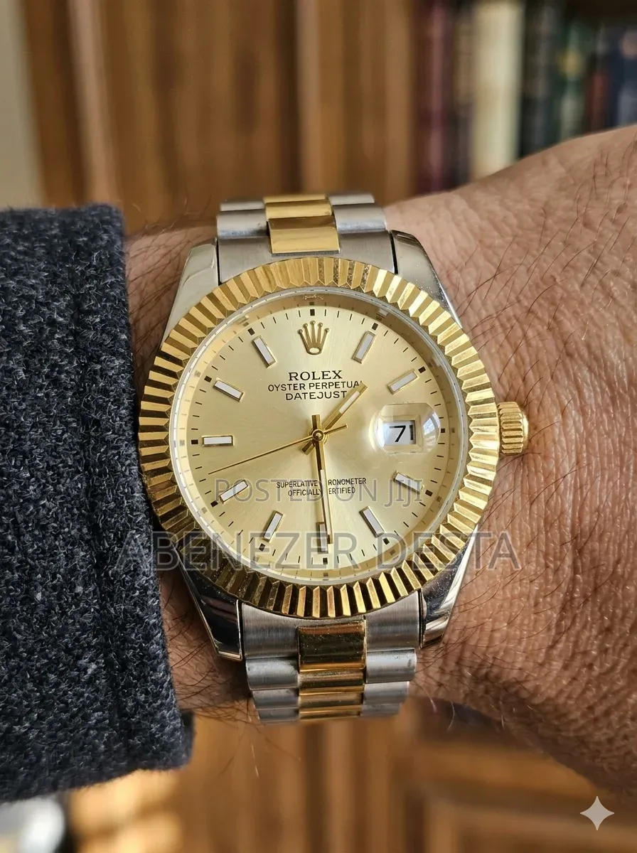 Day-Date Style Watch, Specifically a Stainless Steel Model With a Gold