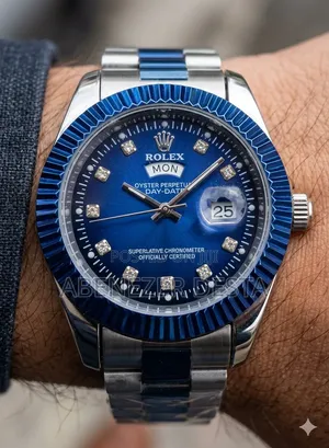 Day-Date Style Watch, Specifically a Stainless Steel Model With a Gold