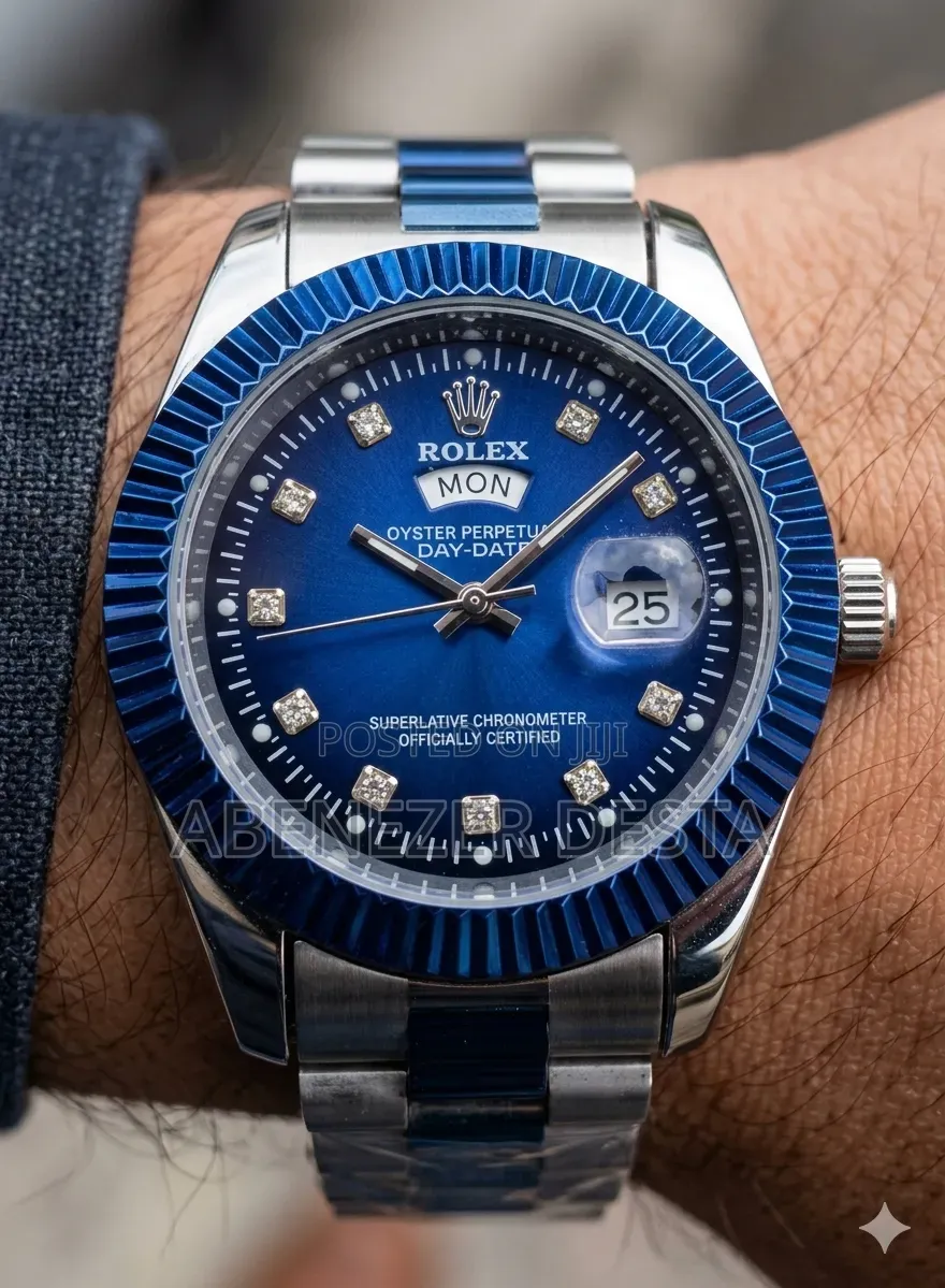 Day-Date Style Watch, Specifically a Stainless Steel Model With a Gold