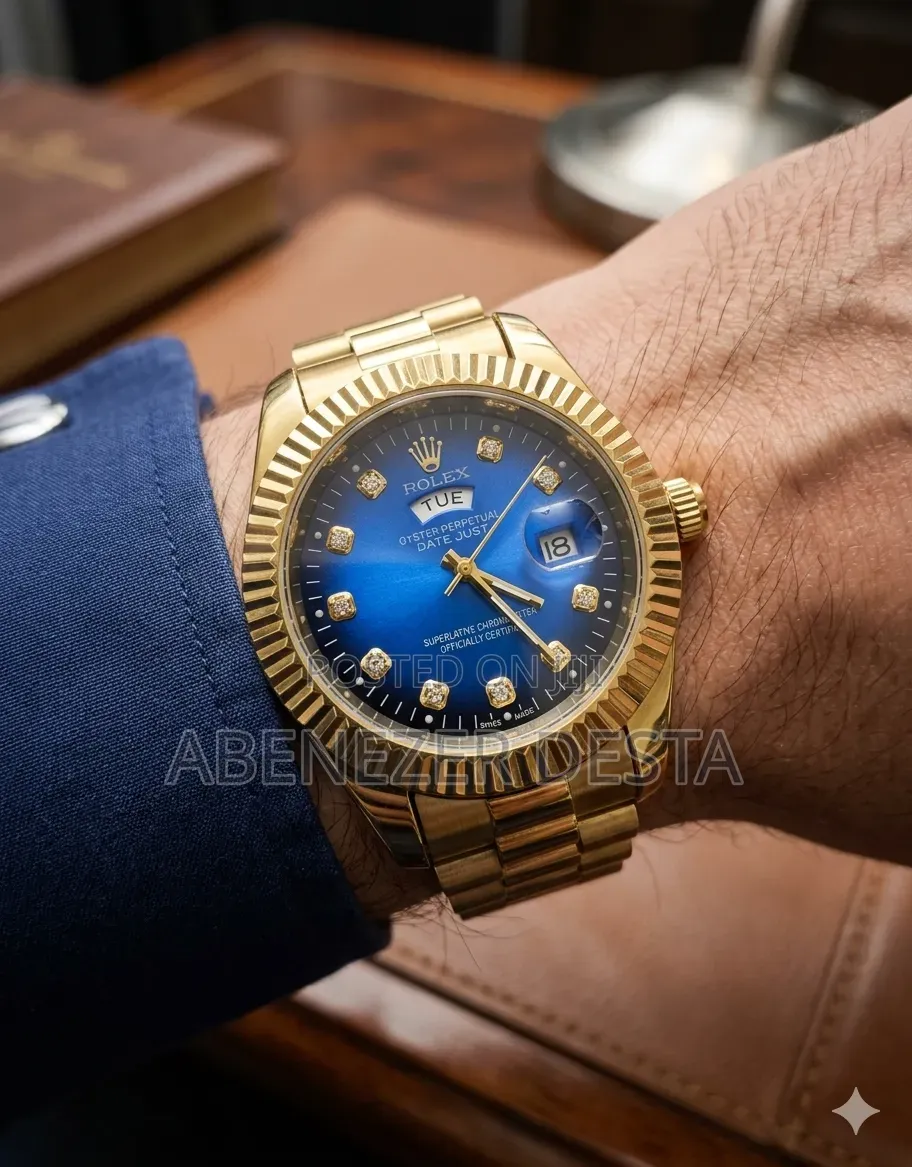 Day-Date Style Watch, Specifically a Stainless Steel Model With a Gold