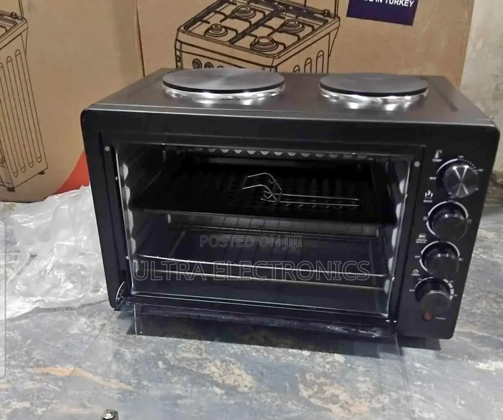 Electric Mini Oven With a 2-Plate Stove on Top.