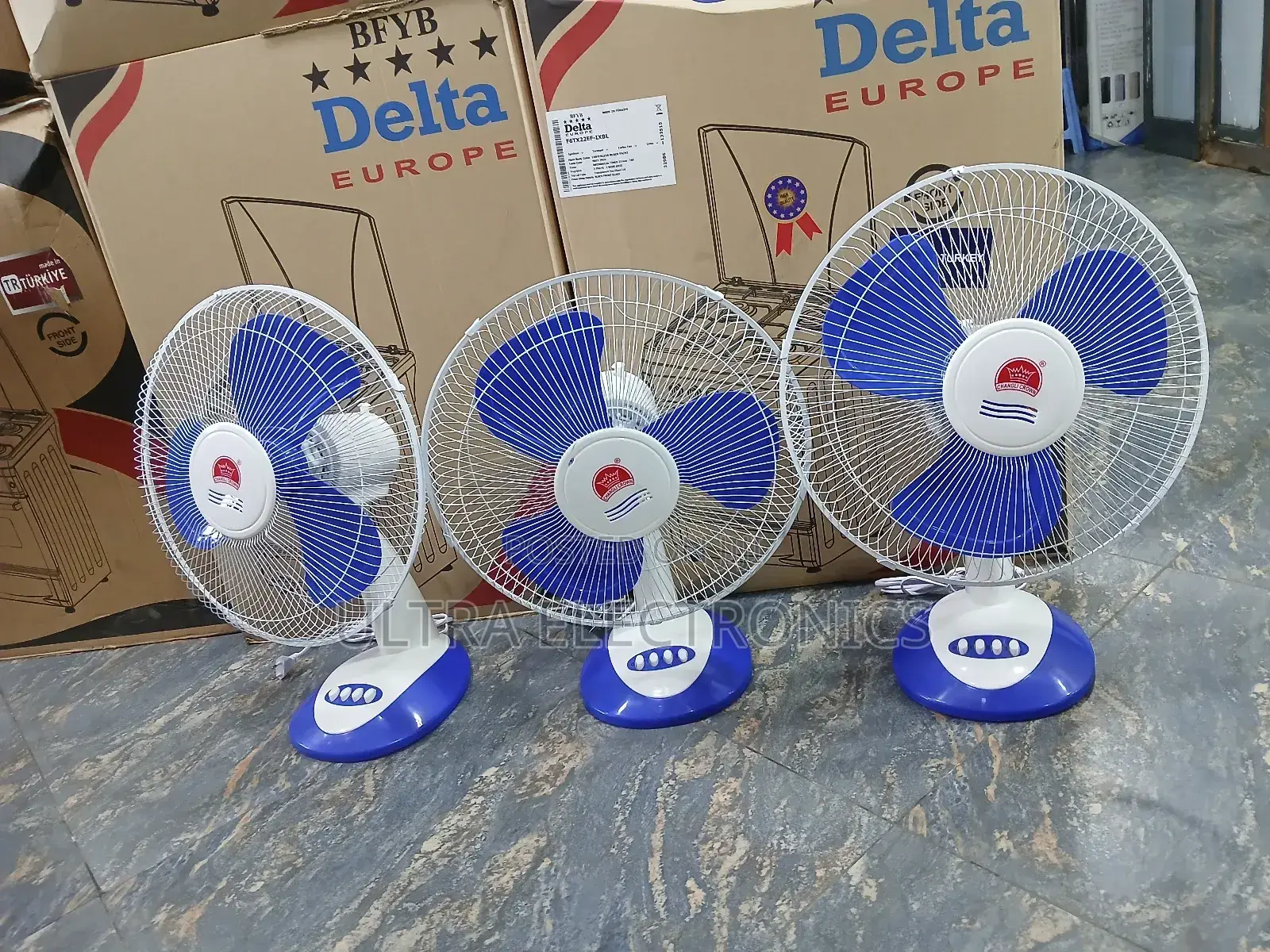 Crown 16-Inch Desk Fans, Featuring Blue Blades and a White Body.