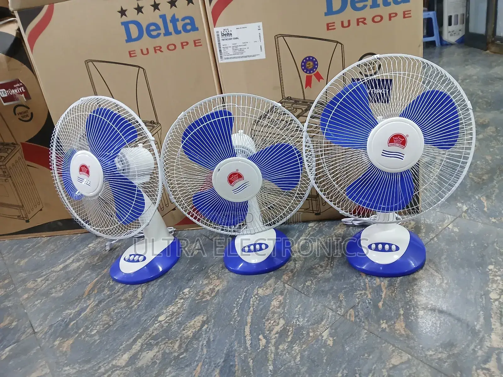 Crown 16-Inch Desk Fans, Featuring Blue Blades and a White Body.
