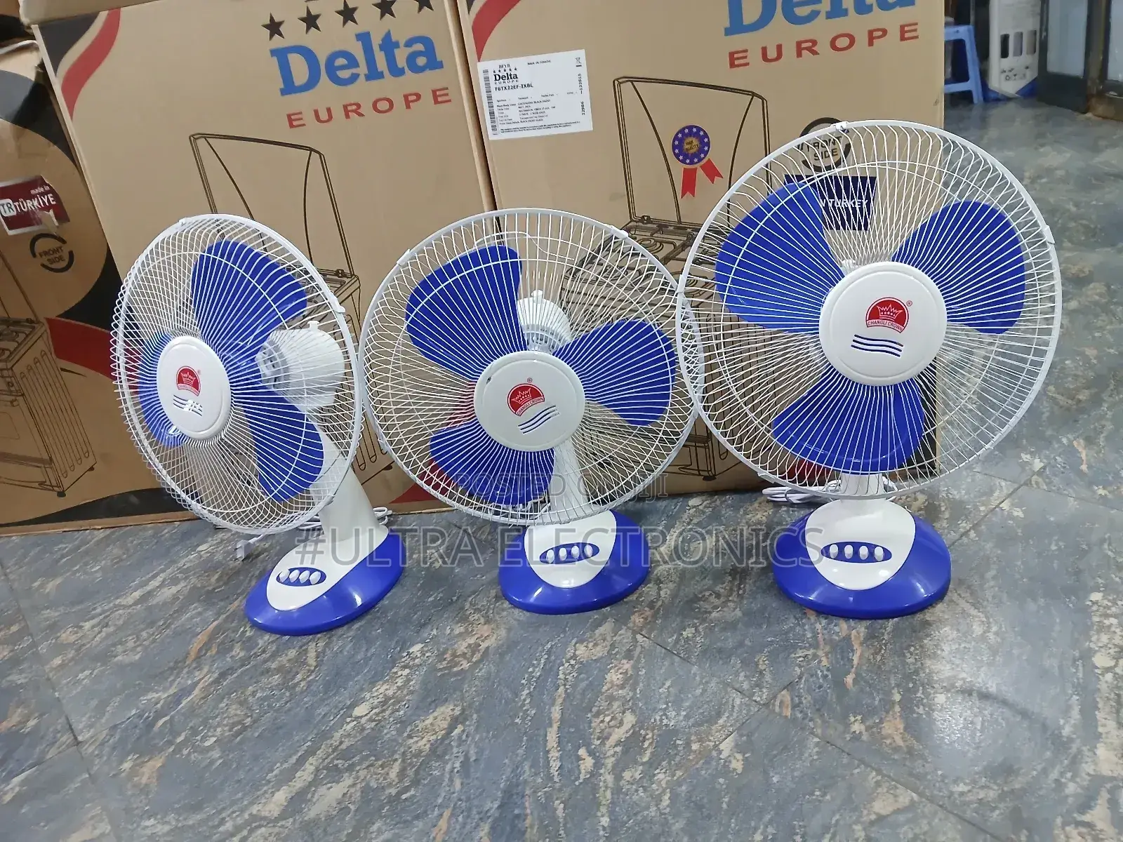 Crown 16-Inch Desk Fans, Featuring Blue Blades and a White Body.