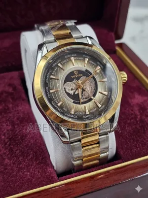 Tevise Wristwatch Features a Gold and Silver Stainless Steel Band And