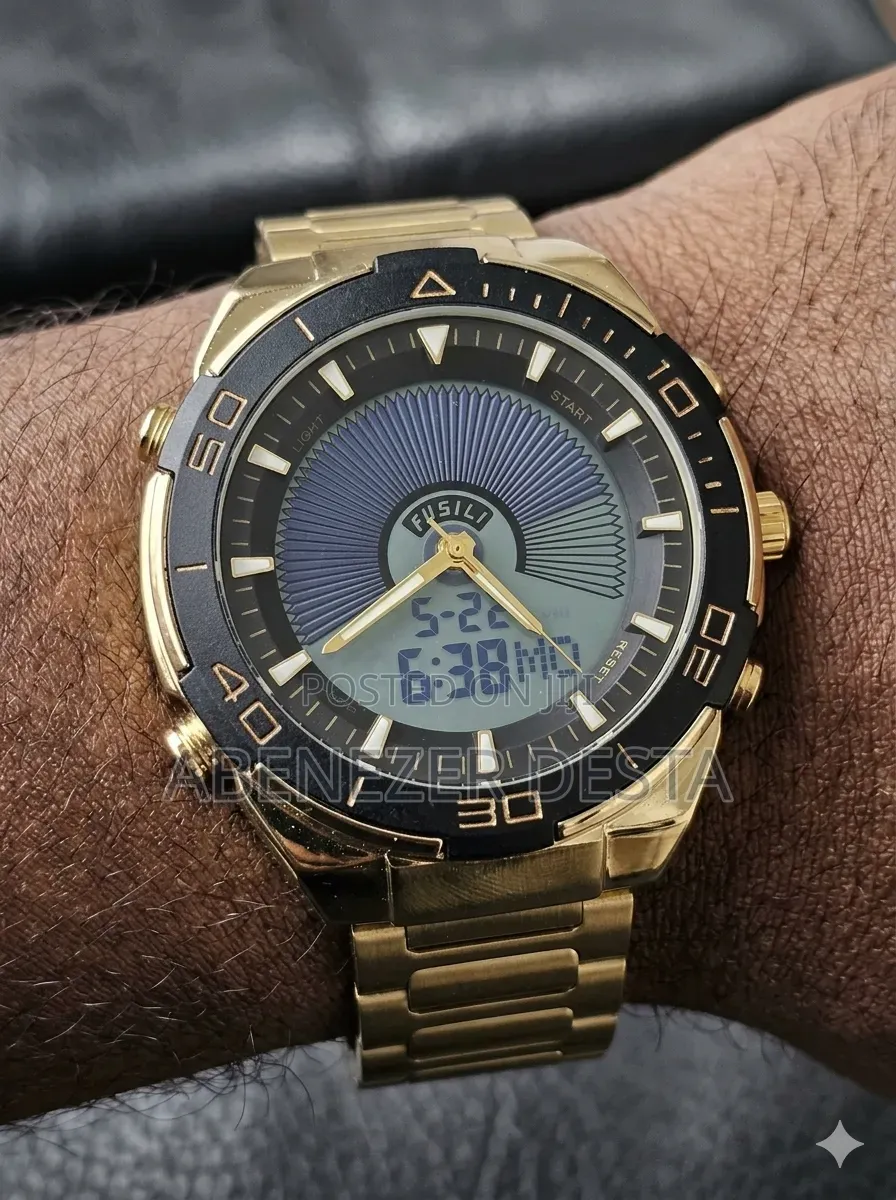 Gold-toned Analog-digital Wristwatch Appears To Be A Dual-time Model L