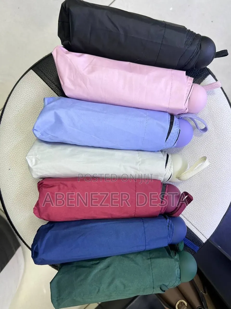 Compact, Capsule-Style Folding Umbrella Designed for Portability.