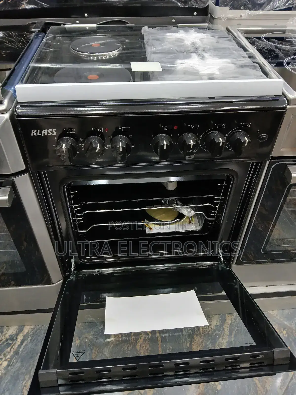 Oven Klass Brand and Stove Range. It Features a Black Finish.