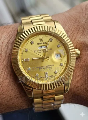 Rolex Day-Date Wristwatch in Yellow Gold With a Champagne Dial. [1, 2]
