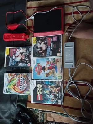Nintendo Wii Mini Red Console With 6 Games and Two Wheels