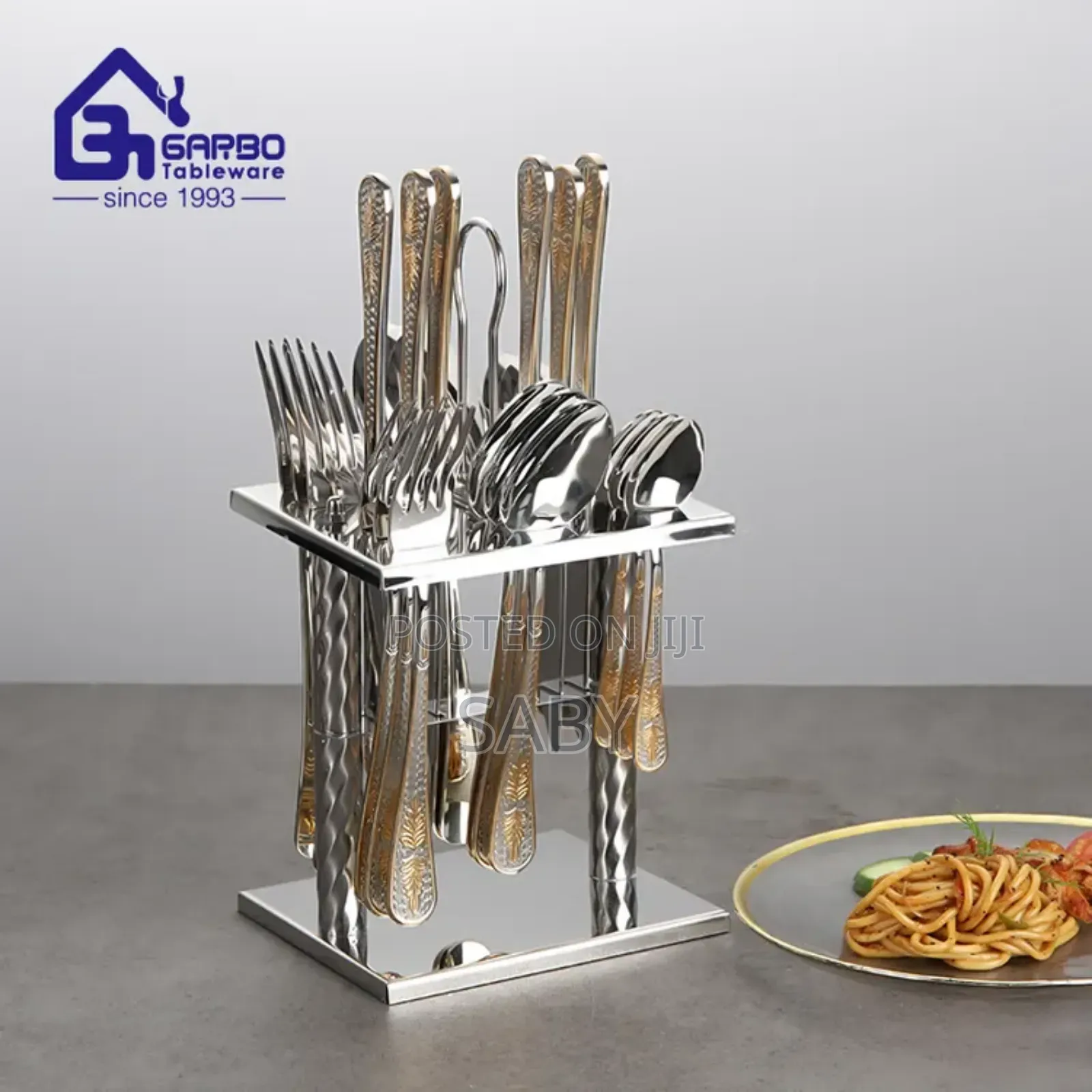 Stainless Steel 24-Piece Cutlery Set With a Gold-Accented Stand.