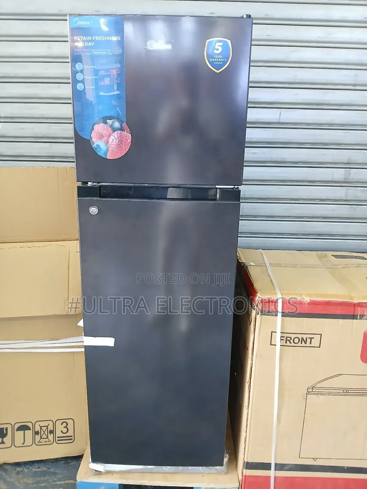 Midea Black Top-Freezer Refrigerator, Likely or Similar, Based on Its